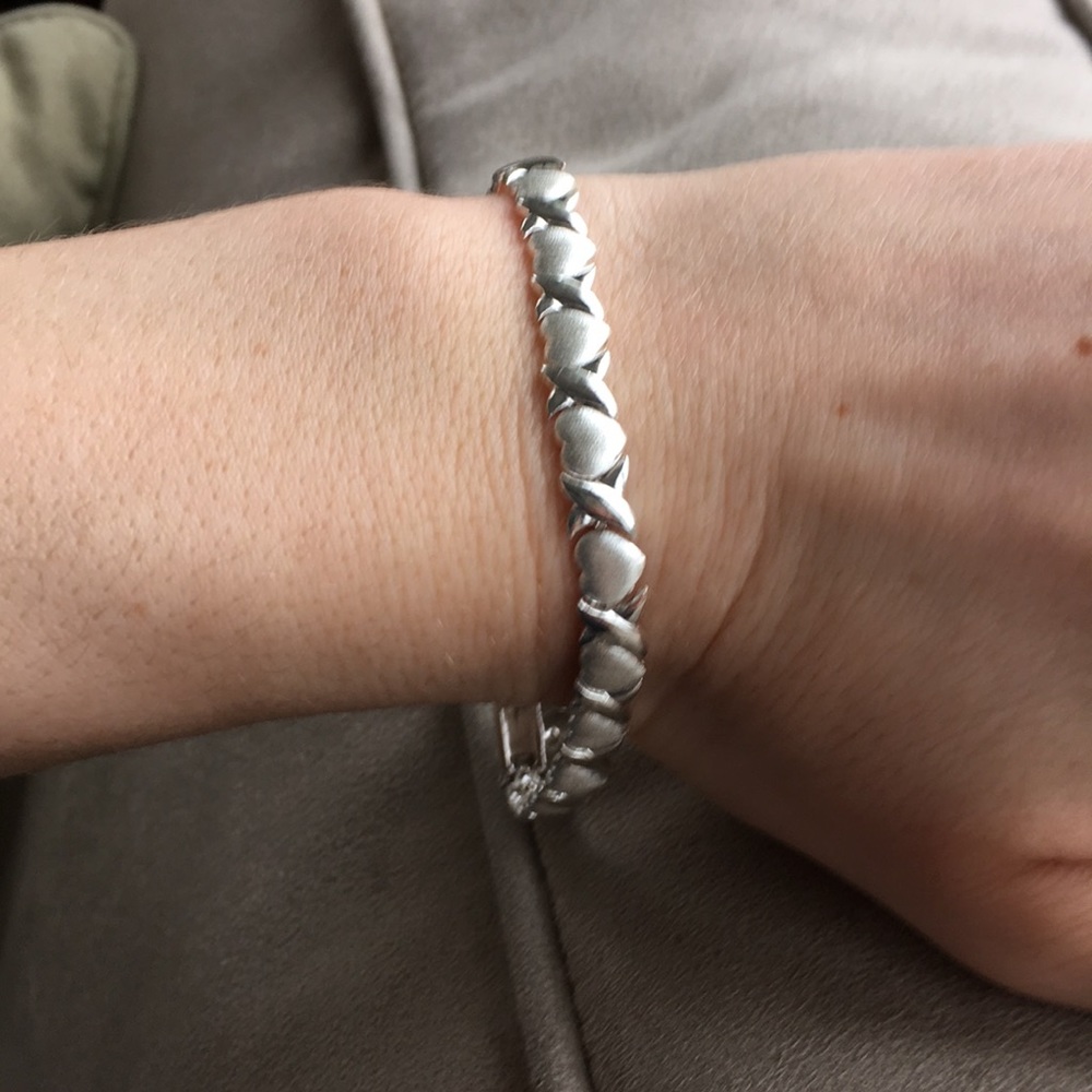 Interlocking heart tennis bracelet